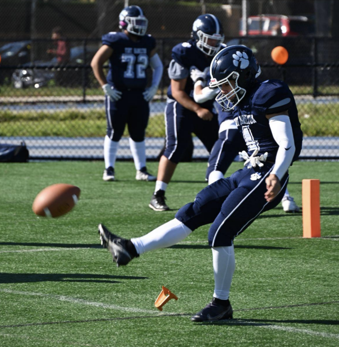 A Tiger kicks off the ball. Photo by Lora Morgenstern